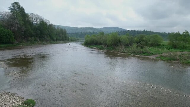 Spring picturesque mountain river band view. (Stryi river near Skhidnytsya village, Carpathians, Ukraine.)
