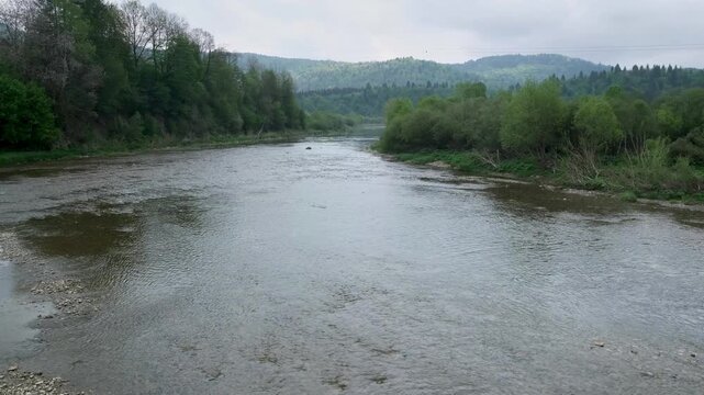 Spring picturesque mountain river band view. (Stryi river near Skhidnytsya village, Carpathians, Ukraine.)