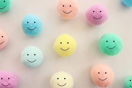 Concept image of group of smiling faces. Metaphor for happiness and satisfaction