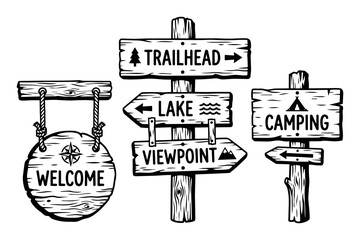 Fototapeta premium Wooden hand-drawn signs providing clear directions for outdoor adventure, welcoming visitors to popular natural destinations