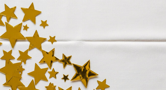 Shining gold stars scattered across white surface
