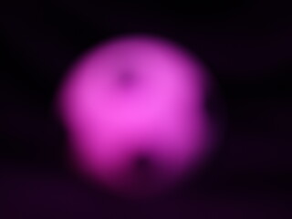 Una toma de cerca de una pelota o balón de fútbol con luces en un fondo negro con algo de desenfoque  © Elika R