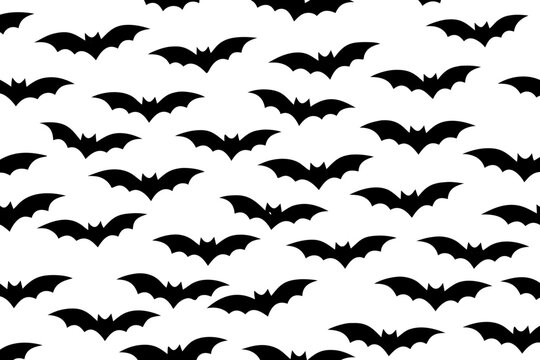 Seamless black bat pattern vector illustration with dark silhouettes isolated on transparent background for Halloween, gothic, spooky textile and wallpaper design