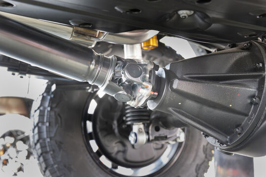SUV car drive shaft with universal joint to differential.