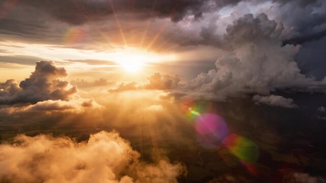 Flying over a panoramic sunset cloudscape, a beautiful aerial timelapse of animated cumulus clouds drifting as the golden sun breaks through with peaceful god rays, set against a dramatic stormy sky.