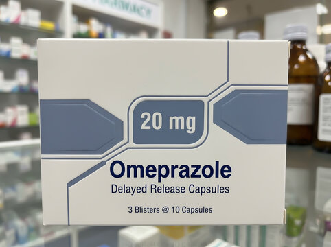 Omeprazole 20 mg medicine box on a blurred pharmacy counter