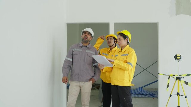 Construction Site Engineer Worker Helmet Inspection Plan Teamwork Interior Renovation Meeting for Building Review in Room