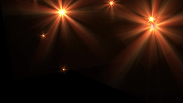 Intense paparazzi camera flashes on black background for carpet night event.
