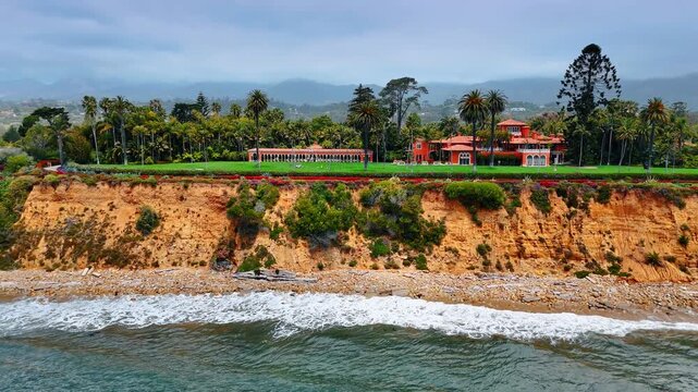 Sprawling beachfront property located along the coastline of Montecito in Santa Barbara County, California. Drone footage from above the Pacific Ocean waterscape.