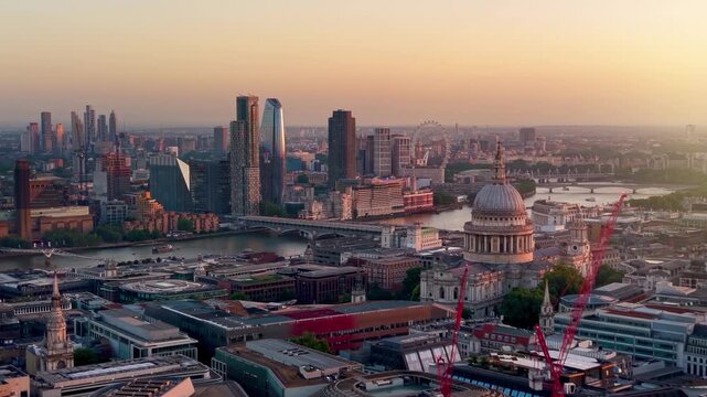 Panoramic aerial view of the skyline of London, England, with St. Pauls Cathdral and Blackfriars during a golden sunset