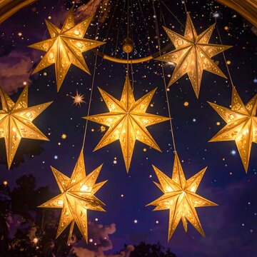 Glowing Golden Star Lanterns Hanging Against Night Sky