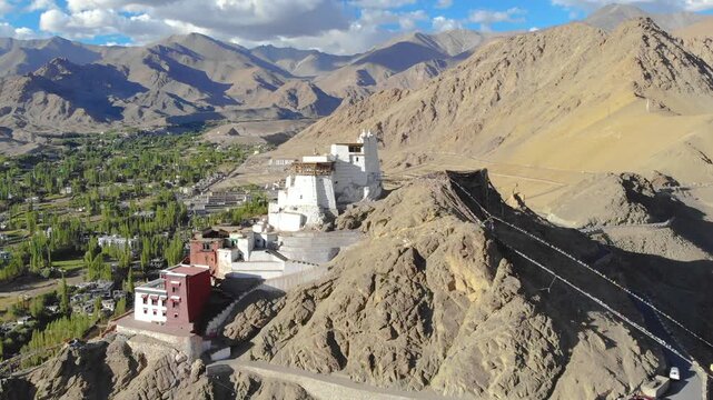 Aerial view of Namgyal Tsemo Monastery with Leh city and mountains.