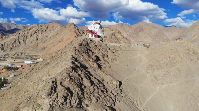 Drone flying forward and up toward Namgyal Tsemo Gompa in Leh India.