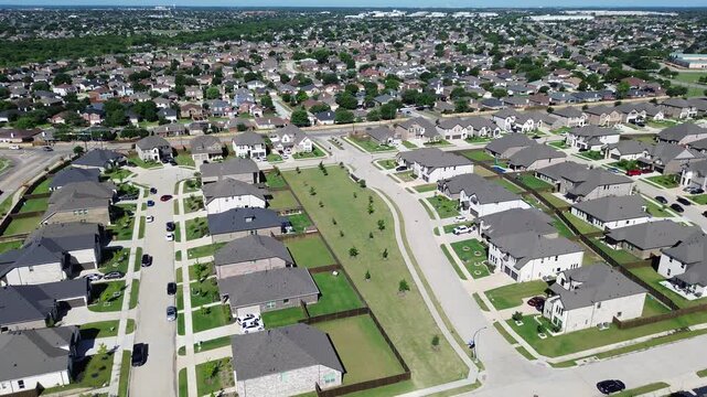 Linear greenbelt spine along Cottle Dr corridor forms open space between rows of homes in this suburban neighborhood. Shingled roofs, young trees even lighting produce smooth tones, Arlington, TX