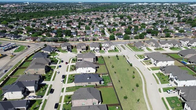 Broad neighborhood grid near Cottle Dr in Arlington, Texas shows long rows of homes and wide park space shaping community layout. Repeating roofs, bright lawns, master planned suburban subdivision