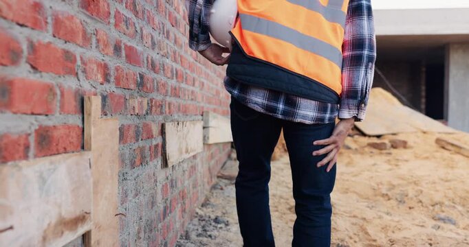 Construction, leg pain or man on site with walk, joint issue or labor injury in building project. Burnout, hurt or engineer with accident, muscle strain or limb sprain in infrastructure development.