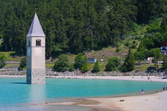The famous half-submerged bell tower of Curon Venosta (german: Graun im Vinschgau). Lake Reschen,  Southern Tyrol, Italy