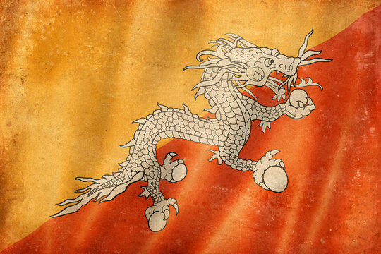 Old vintage flag of Bhutan, worn and stained