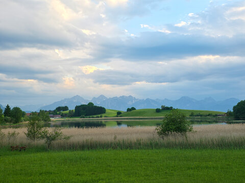 germany, serene lake reflections and alpine grandeur creating a magnificent panoramic summer landscape scene