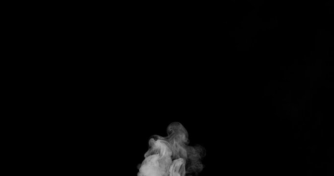 Slow motion white smoke cloud drifting across black background. Realistic atmospheric SFX overlay with detailed swirling vapor, ideal for VFX compositing, transitions and cinematic effects.