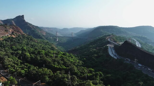 A stunning aerial view of the Mumbai-Pune Missing Link, showcasing one of India&rsquo;s most ambitious expressway projects, cutting through scenic hills and valleys.