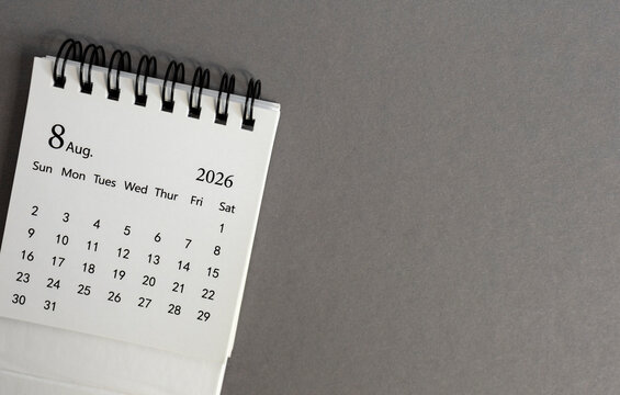 Hello August, desk calendar for planning for August 2026 on a gray background