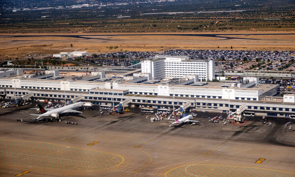 Aerial view of international Athens airport terminal gates with parked aircraft and Sofitel hotel, Greece