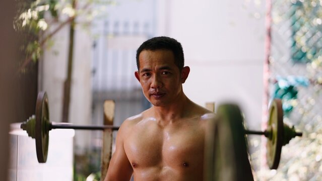 Man sweating after workout, showing his strong physique and dedication to health