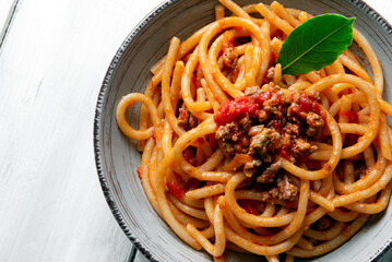 Naklejka premium Pici al ragù di cinta Senese, tipica Pasta Italiana 