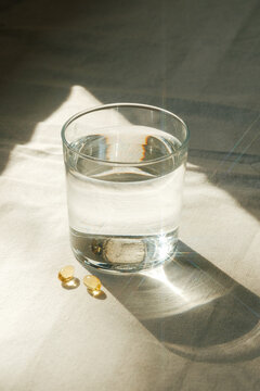 Glass of water and vitamins