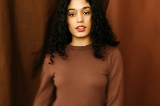Blurry woman in brown outfit