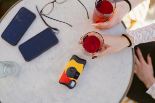 disposable camera and drinks on table