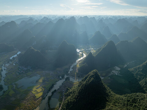 Sun rays over karst valley