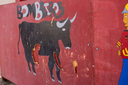 Bullfighting practice board with Bomberos text and bull illustration