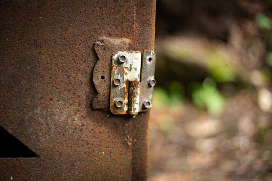old rusty metal door hinge