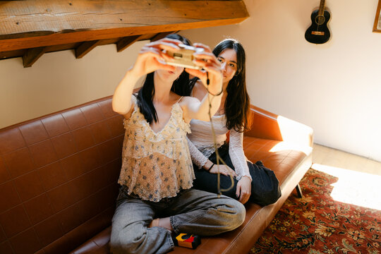young women having fun, taking selfies 