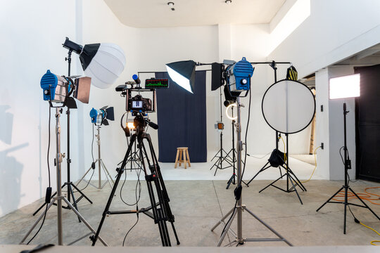 Film production studio with lighting equipment and camera
