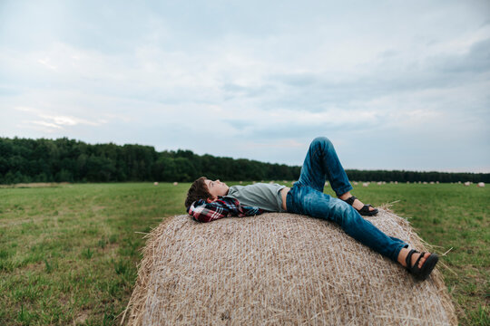 Relaxing on a Warm Summer Afternoon in a Vast Green Field