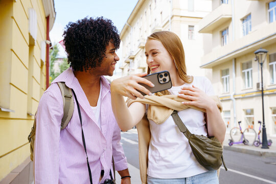 Tourists walk around the city and take photos