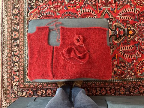 UGC view from above of Knitted garment pieces that need assembling