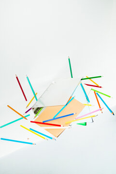 Contemporary office image of binder full of papers and pencils