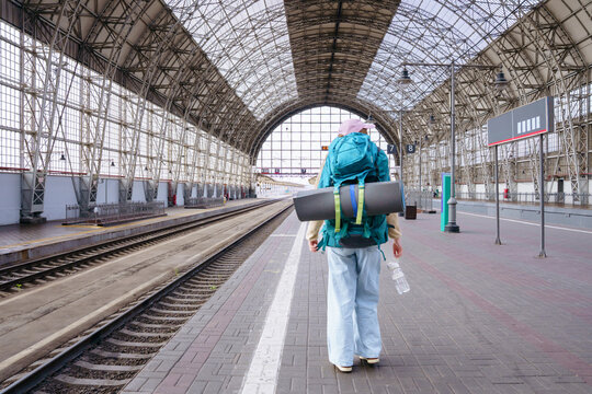 Backpacker at railway station before journey