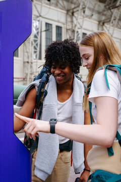 Backpackers at railway station before journey