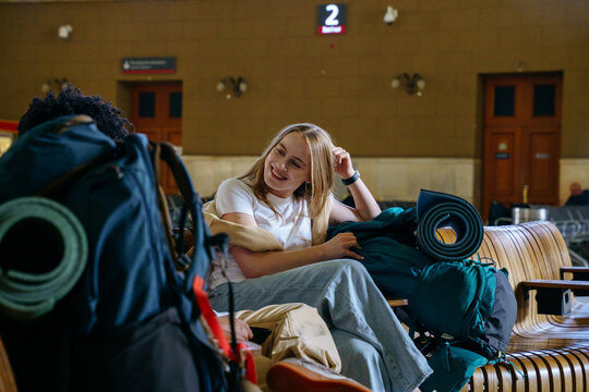 Backpackers at railway station before journey