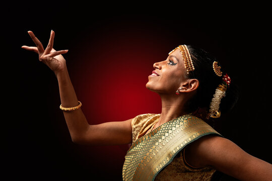 Indian classical dancer performing bharatanatyam mudra gesture