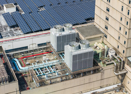 Industrial Rooftop with Solar Panels and Cooling Towers