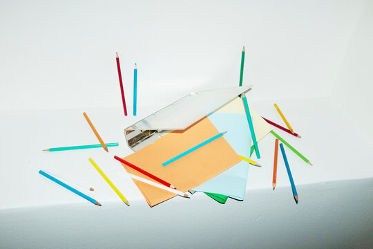 Contemporary office image of binder full of papers and pencils