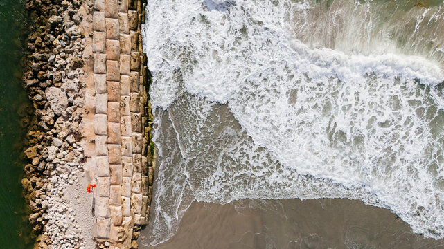 Ocean waves against breakwater