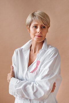 A Woman Stands With Her Arms Crossed, Exuding Confidence