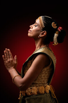 Indian bharatanatyam dancer performing namaste gesture